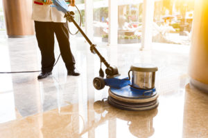 people polishes floor indoors